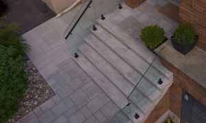 glass custom retaining wall with railings lighting