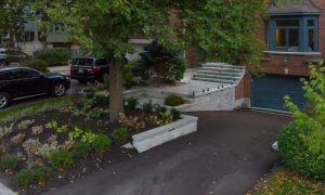 retaining wall with glass railings lighting